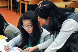 Parent and student working on paperwork