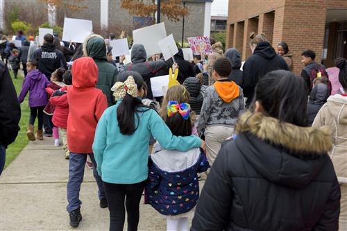 Hundreds of school, family, and community members gather to march around the Faubion/Concordia campus to demonstrate peace 