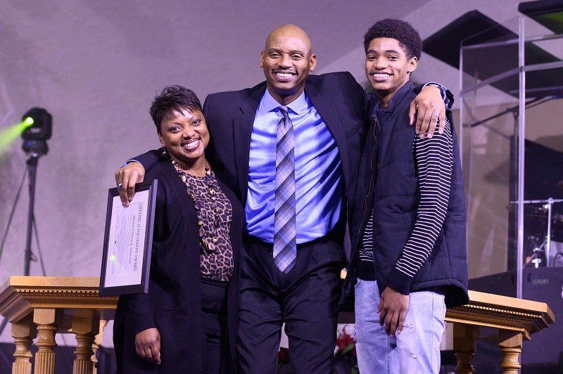 Curtis Wilson with wife and son