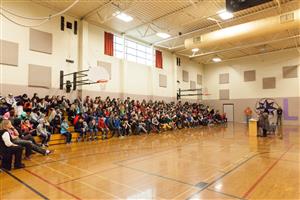 Students listening to Renee Watson's Presentation at Lane Middle School.  
