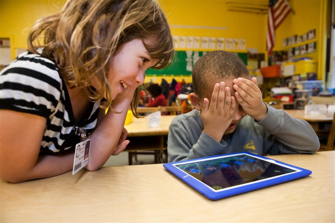 Students in classroom with tablet