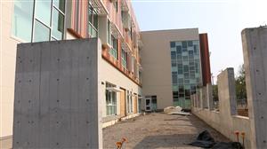 building the walls of the Learning Garden in front of the school 