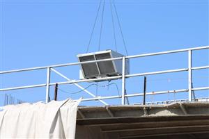HVAC unit lifted by crane