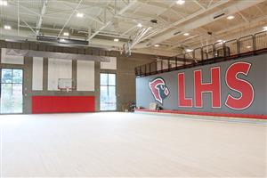 full size Cardinal logo on the wall of the gym