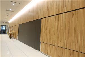 Nearly finshed reclaimed wood paneling in a hallway