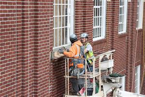 original historic entry facade windows have been rehabilitated and reinstalled