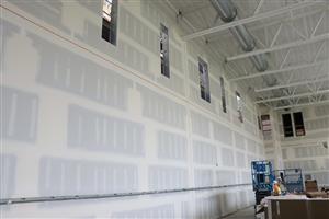 Drywall work is complete in the gym