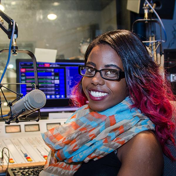 You woman in audio recording booth