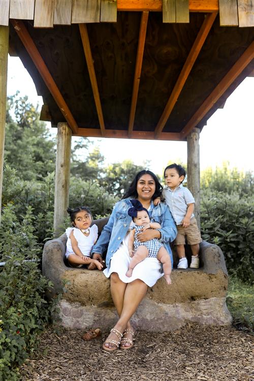 photo with Susy and 3 young children