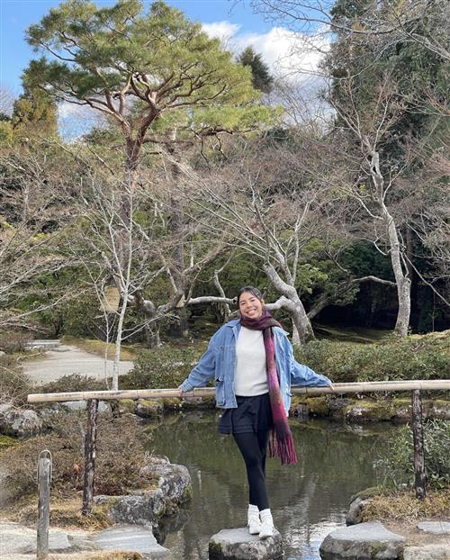 photo of person near water and trees