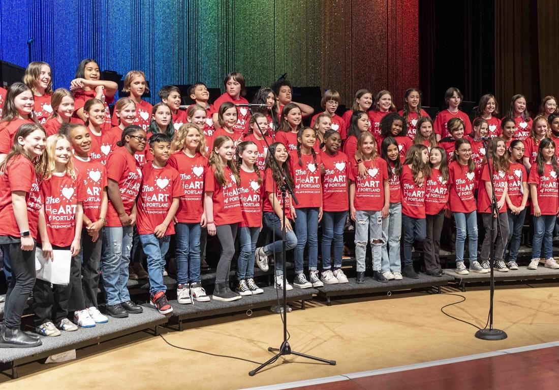 Students singing on stage