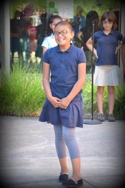 Girl wearing a Rosa Parks uniform 
